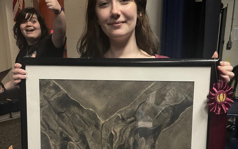 Branford junior Cansadie Huff is pictured with her drawing of hands that won the mixed media category of the Congressional Art Contest for Florida’s District 3. (COURTESY)