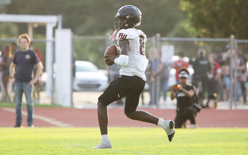 Fort White quarterback Jayden Jackson drops back to pass against Columbia in their spring game on May 17. (BRENT KUYKENDALL/Lake City Reporter)