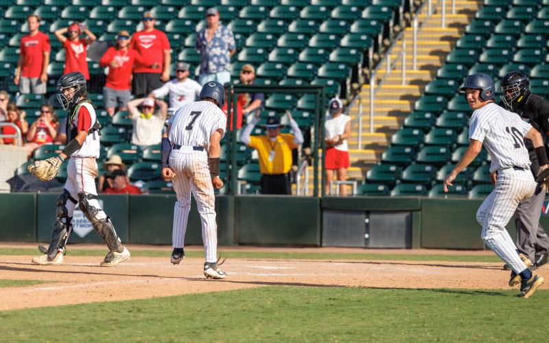 Holmes County center fielder Colby Powell (7) scores the game-winning run with two outs in the bottom of the seventh inning to defeat Lafayette 2-1 in the Class Rural state championship game on Thursday. (JACK HOWDESHELL/Lake City Reporter)