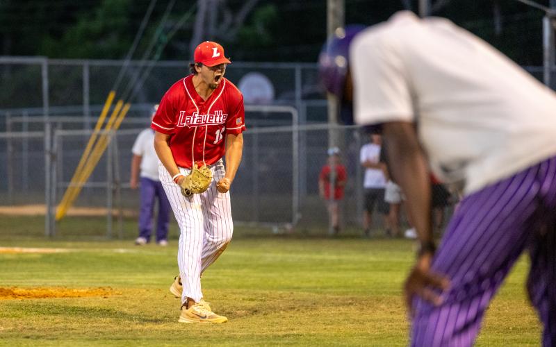Union County coach Jiwan James drops his head as Lafayette pitcher Ethan Tuten celebrates after getting a strikeout to strand two UCHS base runners in the top of the sixth inning during Game 1 of the Region 3-R finals on Monday. (JACK HOWDESHELL/Lake City Reporter)