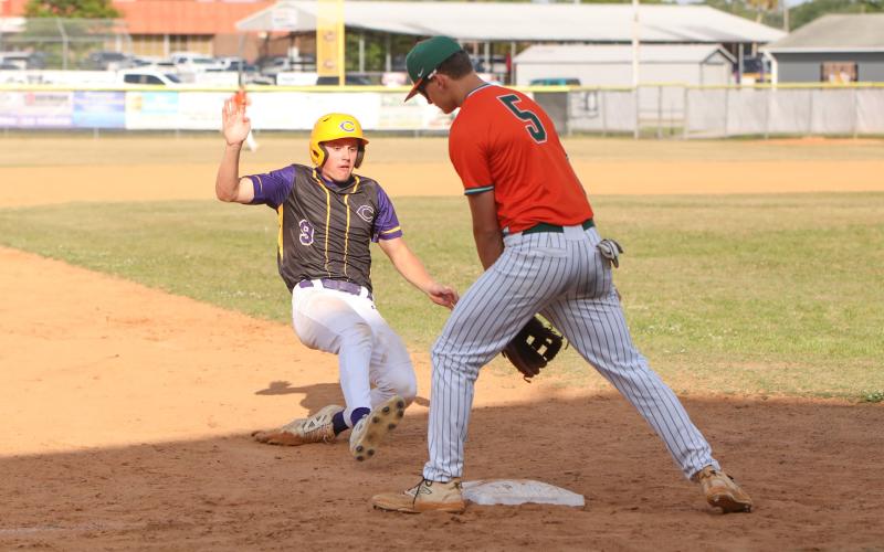 Columbia outfielder Tison McCray slides into third base against Mosley during Game 2 of the Region 1-5A quarterfinals on April 24. (BRENT KUYKENDALL/Lake City Reporter)