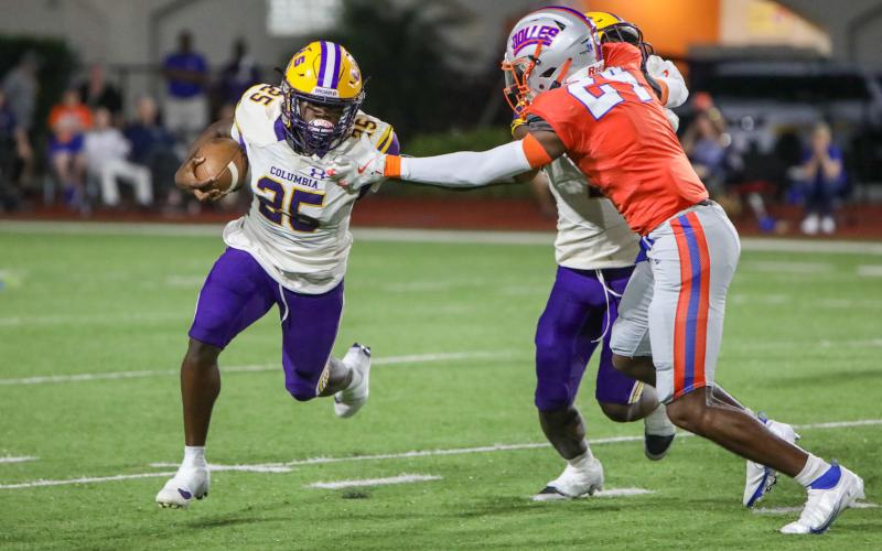 Columbia running back Jerome Horne turns the corner for a gain against Bolles last season. (BRENT KUYKENDALL/Lake City Reporter)