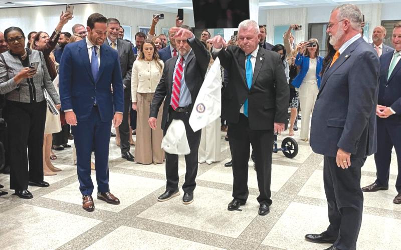 House Speaker Daniel Perez (left) and Senate President Ben Albritton (right) took part in a traditional hanky-drop ceremony marking the end of the legislative  session. (NEWS SERVICE OF FLORIDA)