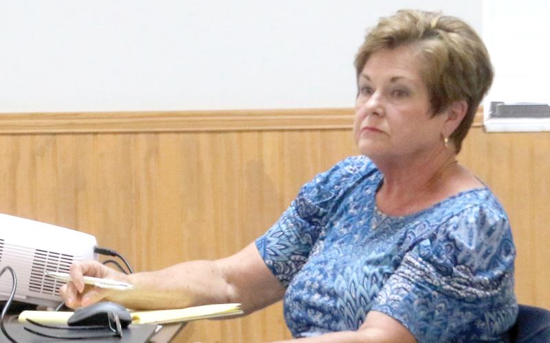 Connie Brecheen, listening at a Fort White town meeting, was selected as the White Springs interim manager Thursday. (FILE)
