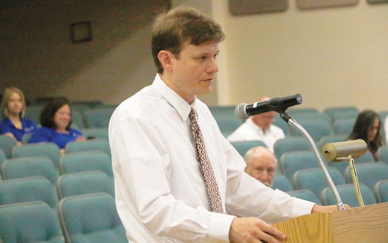 Staz Guntek, Columbia County’s legislative and intergovernmental affairs coordinator, updates the Columbia County Commission on the state budget talks Thursday. (JAMIE WACHTER/Lake City Reporter)