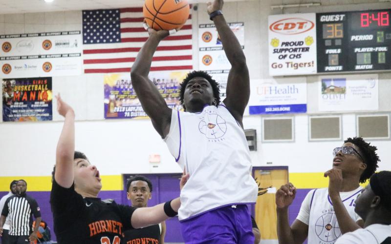 Columbia guard Alfonso Curry rises for a bucket against Hawthorne on Thursday. (JORDAN KROEGER/Lake City Reporter)