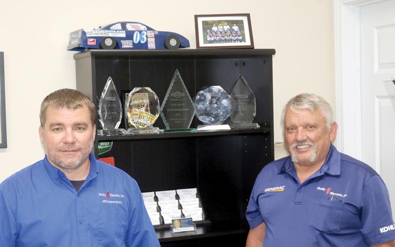 Donald Hollingsworth (right) opened up Holly Electric 30 years ago with help from his family. His son, Donald II (left), is now an equal partner in the Lake City-based business. (TONY BRITT/Lake City Reporter)