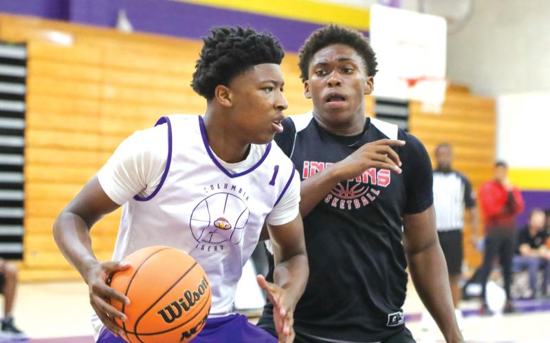 Columbia guard Shaheed White makes a move in the paint Thursday against Fort White in the two teams’ summer league finale. (BRENT KUYKENDALL/Lake City Reporter)