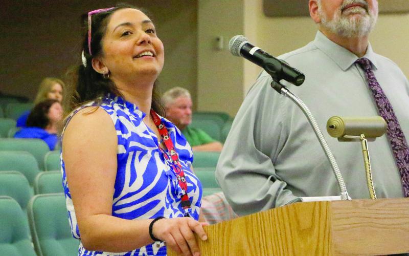 Diana Duque (left), the administrator of health for Columbia County, talks to the Columbia County Commission about proposed fee increases for services at the health department Thursday. (JAMIE WACHTER/Lake City Reporter)