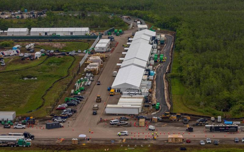 Aerial view of structures including gigantic tents built at the recently opened migrant detention center, Alligator Alcatraz, located at the site of the Dade-Collier Training and Transition Airport in Ochopee on Friday. (PEDRO PORTAL/Miami Herald/TNS)