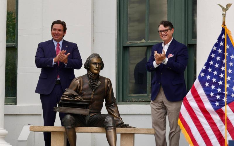 Florida Gov. Ron DeSantis (left) and Secretary of State Cord Byrd applaud the unveiling of a statue of Thomas Jefferson in Jefferson County on Wednesday as part of a new initiative to acquire statues of different counties’ namesakes. (COURTESY)