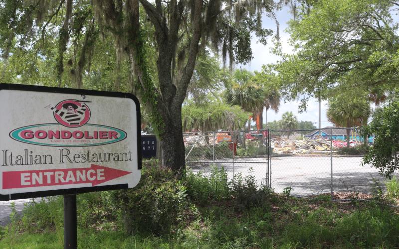 The Gondolier Italian Restaurant and Pizza building was demolished Tuesday afternoon, nearly five years after the restaurant closed in September 2020. (TONY BRITT/Lake City Reporter)