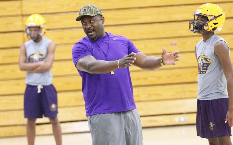 Columbia coach Brian Allen coaches during Monday’s practice, which was forced into the gym due to extreme heat. (JORDAN KROEGER/Lake City Reporter)