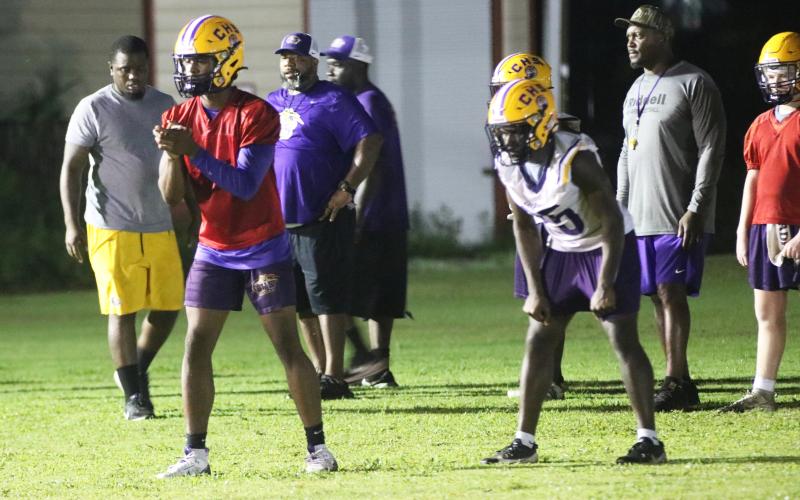 Columbia quarterback Xavier Collins (left) gets set to take a snap alongside running back Jerome Horne during Tuesday's practice. (JORDAN KROEGER/Lake City Reporter)