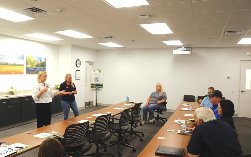 Land planners Kristin Reed (left) and Blair Knighting get feedback and information from local business and development representatives during a meeting on Friday as the county looks to upgrade its land development regulations. (TONY BRITT/Lake City Reporter)