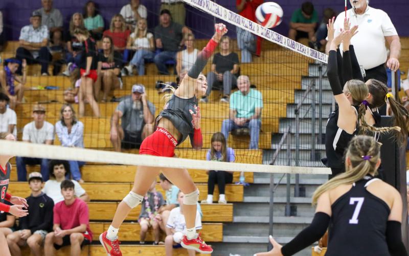 Lafayette outside hitter Kayley Johnson fires a shot over the net against Columbia on Thursday. (BRENT KUYKENDALL/Lake City Reporter)