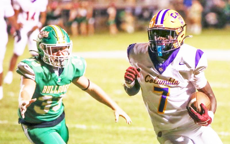 Columbia receiver Kyren Caldwell turns up field after a catch against Suwannee on Friday. (BRENT KUYKENDALL/Lake City Reporter)