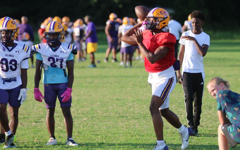 Columbia quarterback Xavier Collins throws a pass during practice on Tuesday. (JORDAN KROEGER/Lake City Reporter)