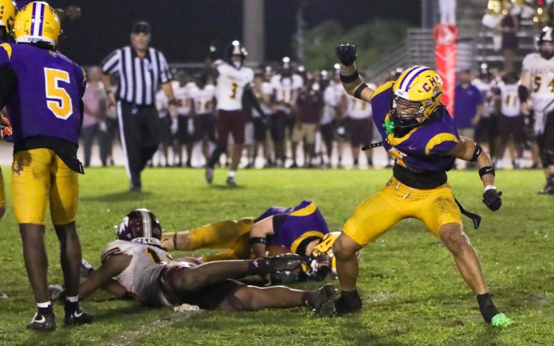 Columbia safety Julian De La Cruz celebrates after making a fourth-down stop to seal Friday’s win over Coffee. (BRENT KUYKENDALL/Lake City Reporter)