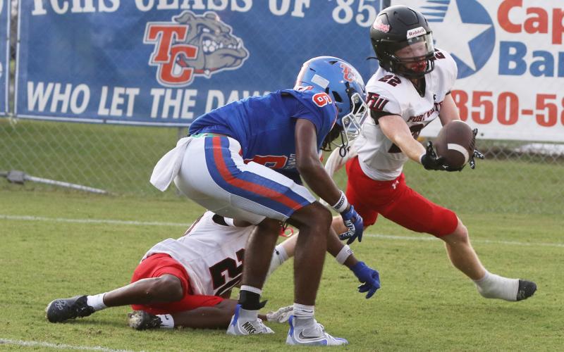 Fort White linebacker Wyatt Holton (22) intercepts a Taylor County pass last Friday. (MORGAN MCMULLEN/Lake City Reporter)