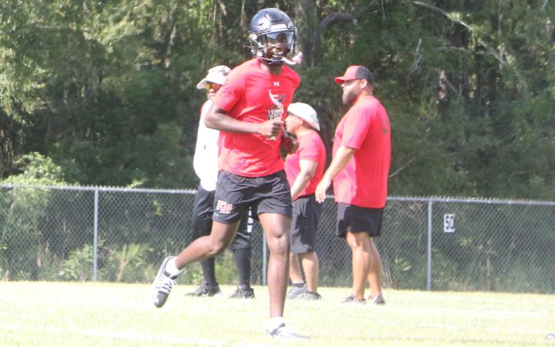 Fort White’s Jayden Jackson is all smiles ahead of Fort White’s first day of fall practice on July 28. (MORGAN MCMULLEN/Lake City Reporter)