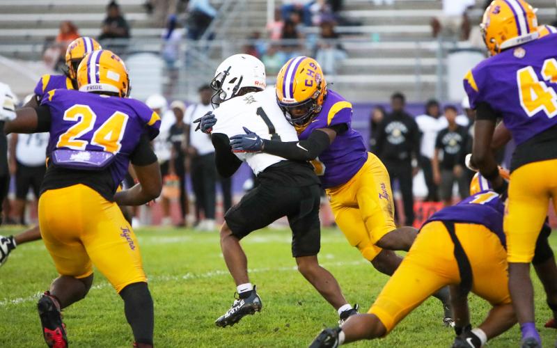 Columbia defensive back Von Lane tackles Oakleaf running back Mike Conner during Friday’s Preseason Classic. (BRENT KUYKENDALL/Lake City Reporter)