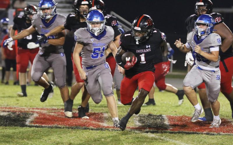 Fort White running back John’l Lawson breaks loose for a touchdown run against Belleview on Friday. (MORGAN MCMULLEN/Lake City Reporter)