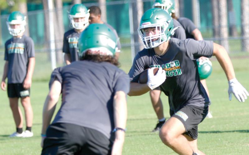 Suwannee receiver Koy Frier runs up the field after a catch during practice on July 28. (JAMIE WACHTER/Lake City Reporter)