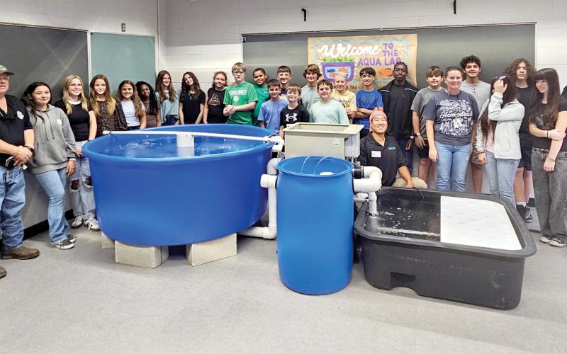 Suwannee Middle School staff and students are pictured after the aquaponics lab was installed for Megan Collins’ homesteading class. (COURTESY)