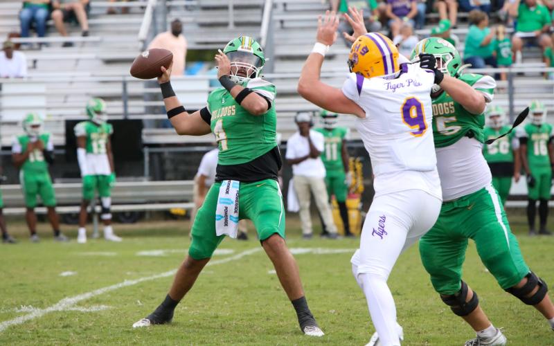 Suwannee quarterback Thomas Sikes drops back to pass against Columbia last Friday. (BRENT KUYKENDALL/Lake City Reporter)