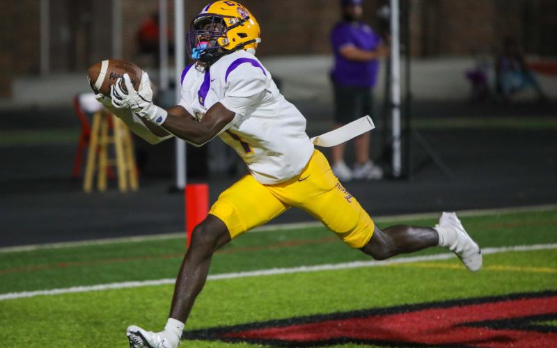 Columbia receiver Kyren Caldwell hauls in a touchdown pass Friday night against Hillsborough. Caldwell had three scoring catches on the night. (BRENT KUYKENDALL/Lake City Reporter)