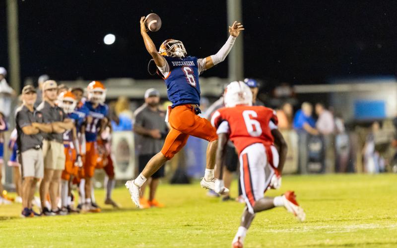 Branford running back TC Smith makes a leaping one-handed grab on fourth down against Hilliard on Friday. (JACK HOWDESHELL/Lake City Reporter)