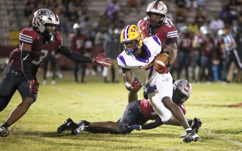 Columbia receiver Kyren Caldwell turns up field after a catch against Madison County last Friday. (BRENT KUYKENDALL/Lake City Reporter)