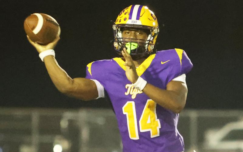 Columbia quarterback Xavier Collins throws a pass against Trinity Christian last Friday. (PAUL BUCHANAN/Lake City Reporter)