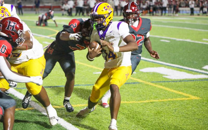 Columbia quarterback Xavier Collins looks for running room during last Friday’s win over Hillsborough. (BRENT KUYKENDALL/Lake City Reporter)