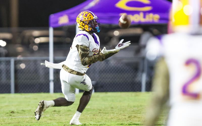 Columbia receiver Kyren Caldwell hauls in a pass against St. Augustine on Friday. (GARY LLOYD MCCULLOUGH/Special to the Reporter)