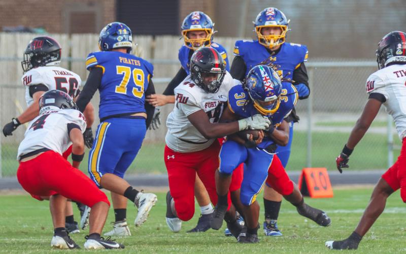 Fort White linebacker Dreyson Lally makes a tackle against Fernandina Beach last Friday. (ASHLEY CHANDLER/Fernandina Beach News-Leader)