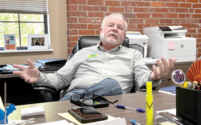 Suwannee County Administrator Greg Scott talks in his office in downtown Live Oak on Sept. 11. Scott is retiring Friday after nearly 37 years of service to Suwannee County as both parks director and county administrator. (JAMIE WACHTER/Lake City Reporter)