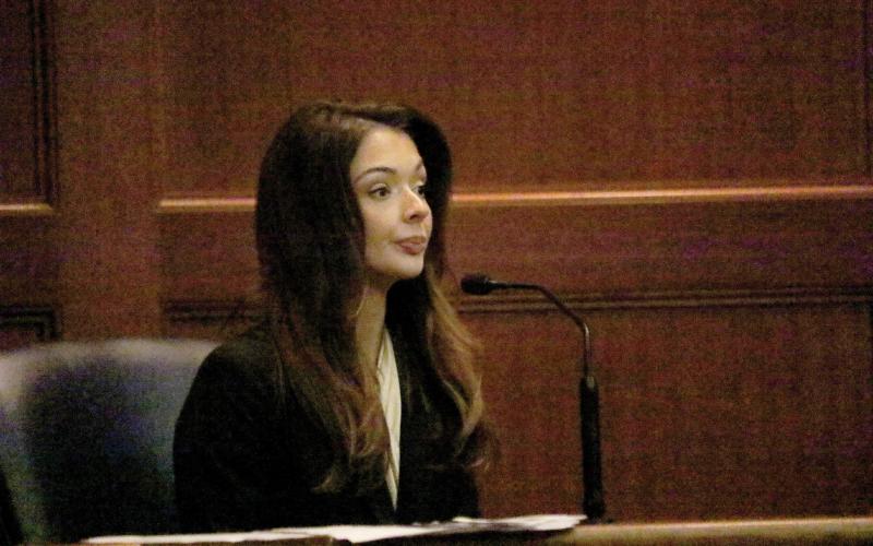 Miss United States Lindsey Langston, a Columbia County resident, sits on the witness stand in a hearing Friday morning at the Columbia County Courthouse. Langston is seeking an injunction for protection from stalking against U.S. Rep. Cory Mills, her former boyfriend. (TONY BRITT/Lake City Reporter)