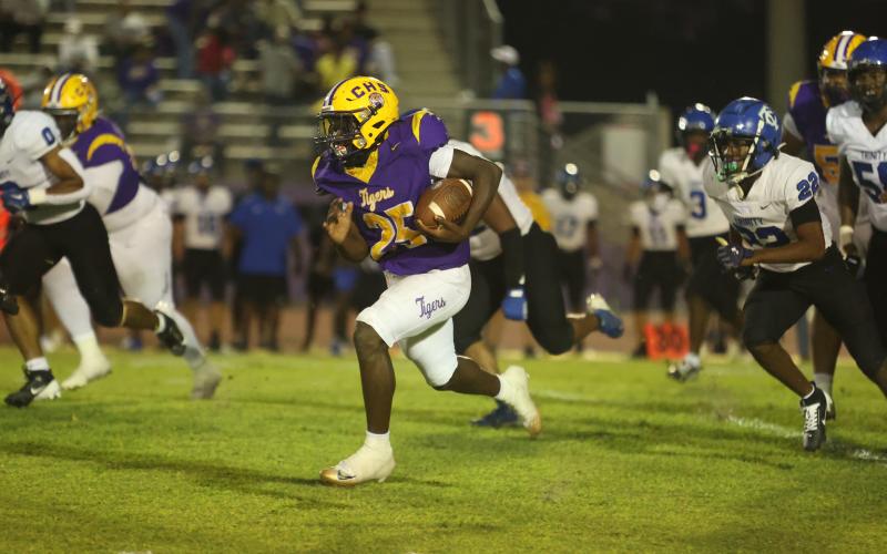 Columbia running back Jerome Horne breaks into the open field against Trinity Christian on Friday. (PAUL BUCHANAN/Lake City Reporter)