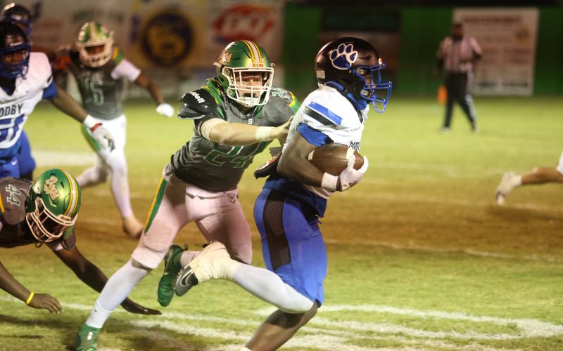 Suwannee defensive end Kyler Watson chases after a Godby ballcarrier during Friday's 36-31 loss. (PAUL BUCHANAN/Lake City Reporter)