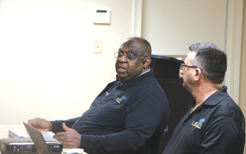 Lake City Manager Don Rosenthal (left) responds to a question during Monday’s Lake Shore Hospital Authority meeting. Rosenthal pitched the city’s plan for 12 vacant lots the Authority is looking to donate. (MORGAN MCMULLEN/Lake City Reporter)