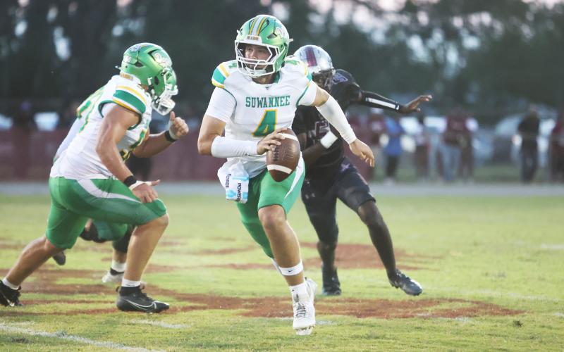 Suwannee quarterback Thomas Sikes scrambles up field against Madison County last Friday. (PAUL BUCHANAN/Lake City Reporter)