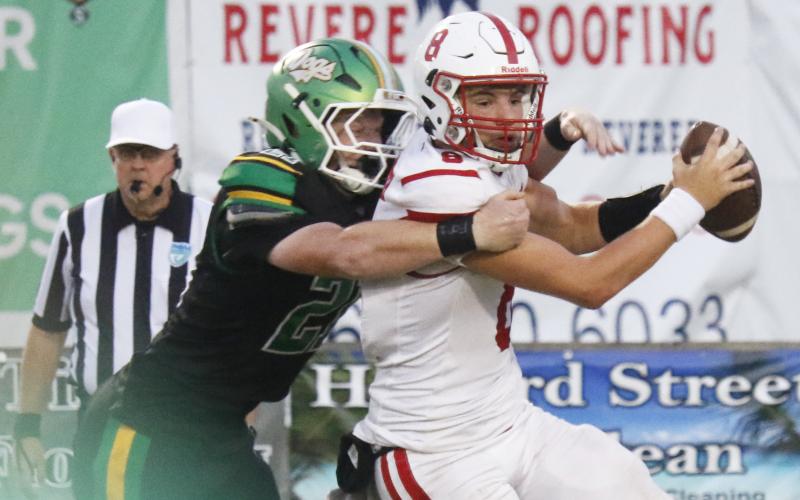 Suwannee defensive end Hunter Watson sacks Hamilton County quarterback Haigen Johnson on Friday. (JAMIE WACHTER/Lake City Reporter)