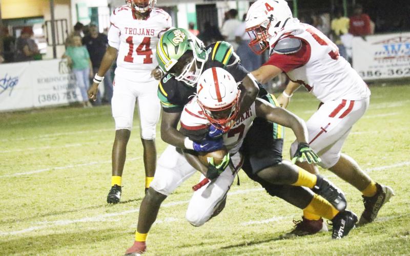 Suwannee defensive lineman Kamari Thompson tackles Hamilton County running back Matthew Berry on Friday. (JAMIE WACHTER/Lake City Reporter)