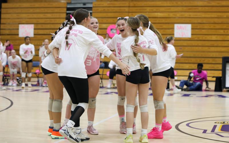 Columbia's volleyball team celebrates after a point during Tuesday's win over Lowndes. (BRENT KUYKENDALL/Lake City Reporter)