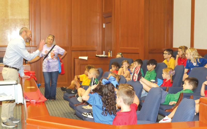 State Attorney for the Third Judicial Circuit John Durrett (left) walks Belmont Academy students through the legal process during a field trip on Thursday. (TONY BRITT/Lake City Reporter)