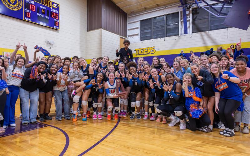 Branford's volleyball team celebrates with fans after defeating Union County to win the District 6-R title on Thursday. (JACK HOWDESHELL/Lake City Reporter)