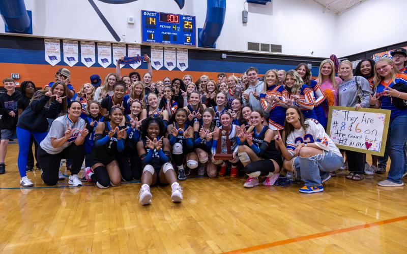 Branford's volleyball team celebrates with fans after defeating Union County to win a third straight Region 3-R title on Tuesday. (JACK HOWDESHELL/Lake City Reporter)