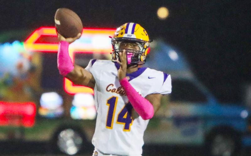 Columbia quarterback Xavier Collins throws a pass against Ridgeview on Oct. 10. (BRENT KUYKENDALL/Lake City Reporter)